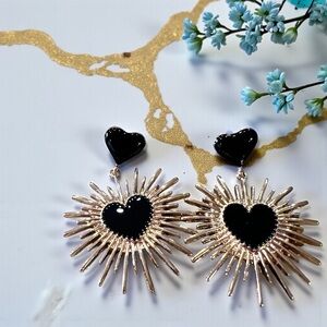 Black and Gold Toned Dangling Starburst Enamel Heart Earrings